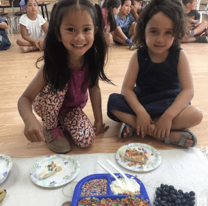 a child working on arithmetic using Montessori golden bead materials