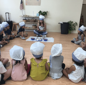 a child sequencing Montessori red rods to explore length and comparison