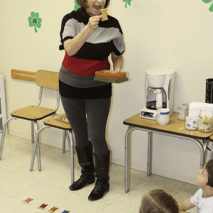 children exploring size relationships with Montessori knobbed cylinders