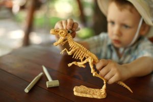 students creating individual art projects, expressing creativity with Montessori materials