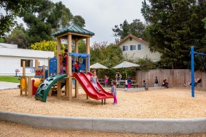 children using Montessori sensorial materials to enhance tactile learning