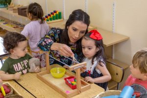 students creating imaginative stories using Montessori language materials