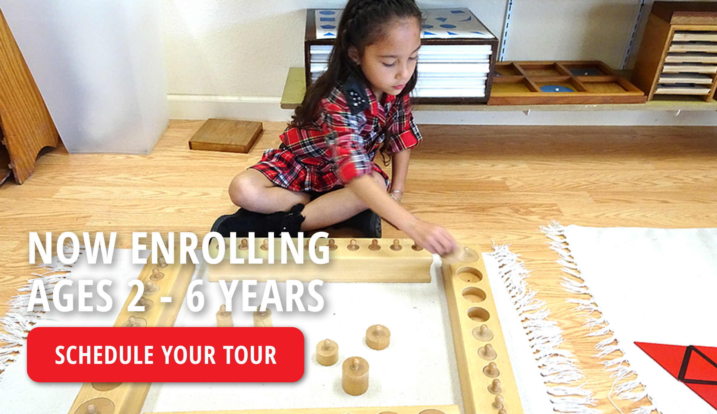 students practicing early writing skills with Montessori movable alphabet